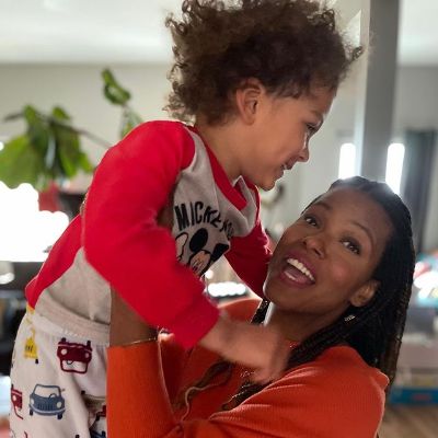 Cassandra Freeman is holding Hudson above her in the picture.